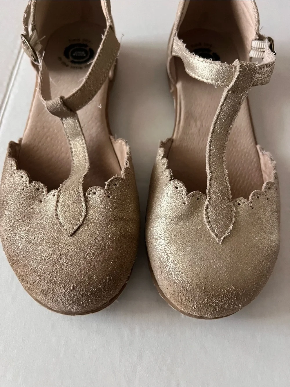 Livie & Luca Metallic Gold T‑Strap Scalloped Dress Shoes